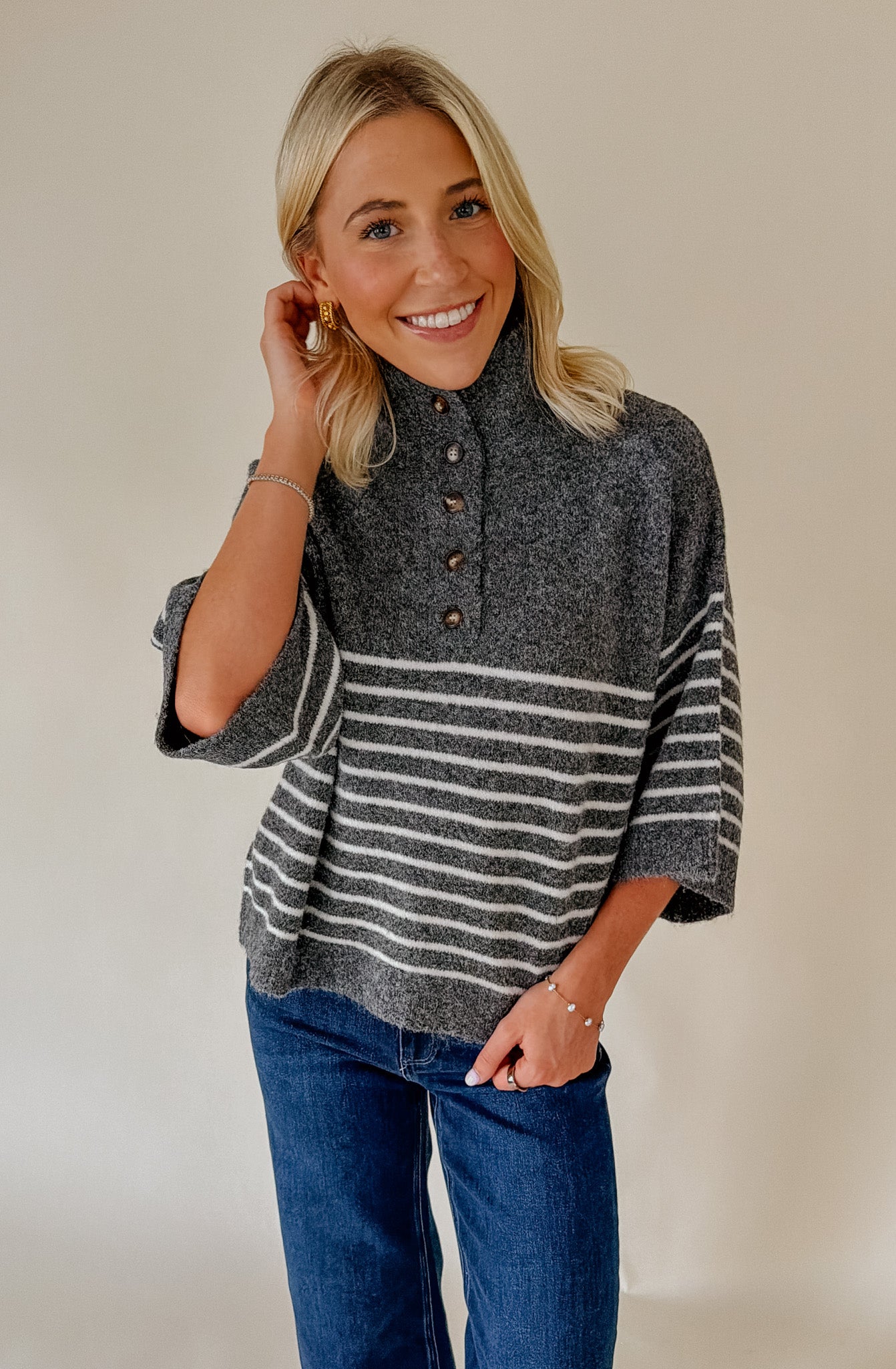 THE REAGAN STRIPED MOCK NECK SWEATER