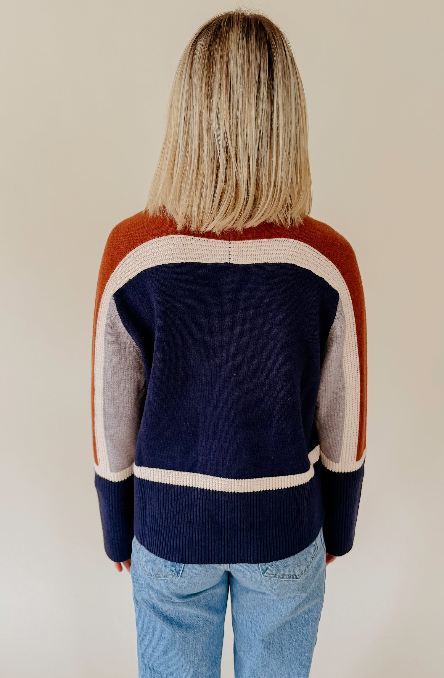 SPLIT DECISION MOCK NECK SWEATER