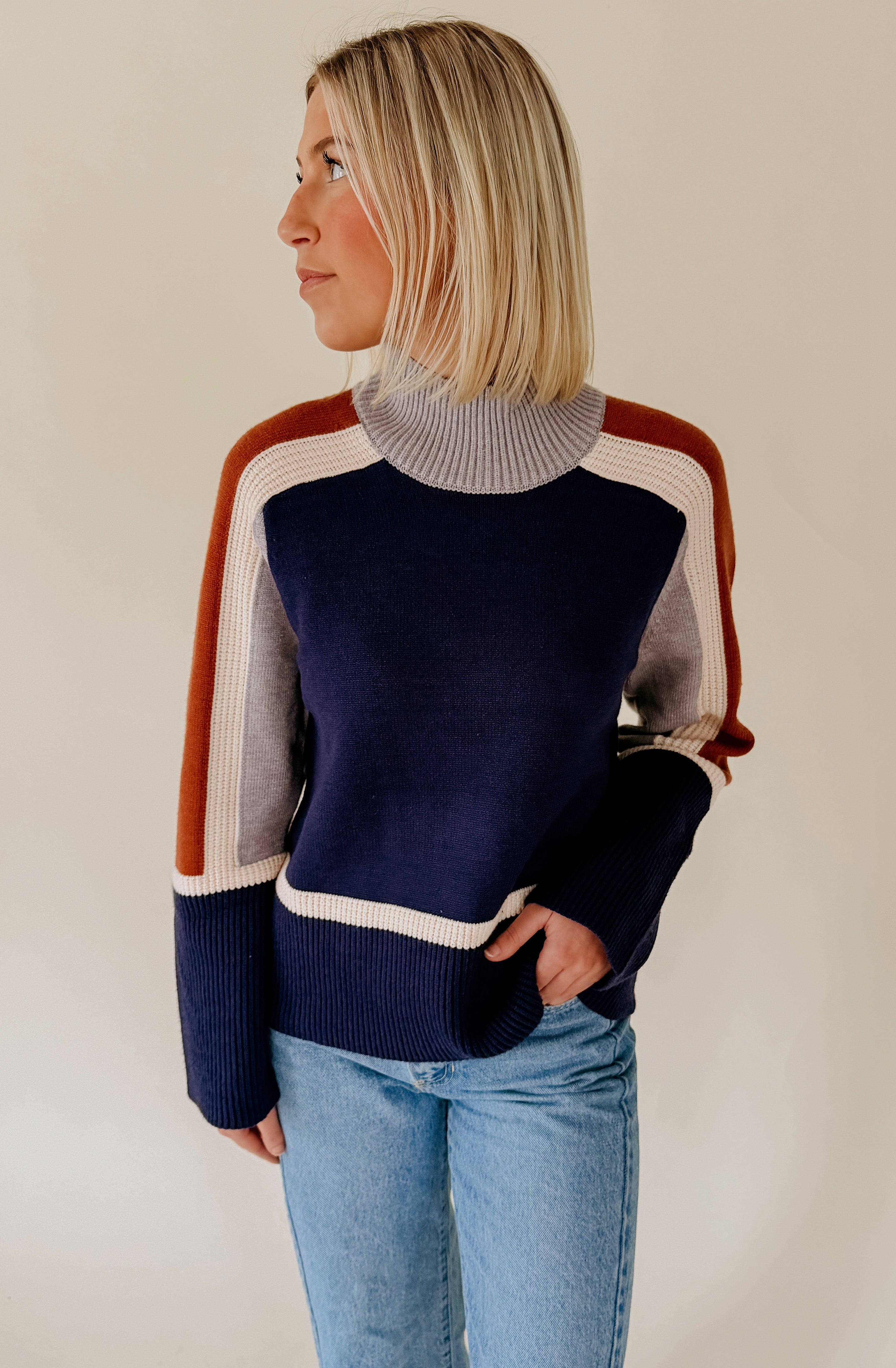 SPLIT DECISION MOCK NECK SWEATER