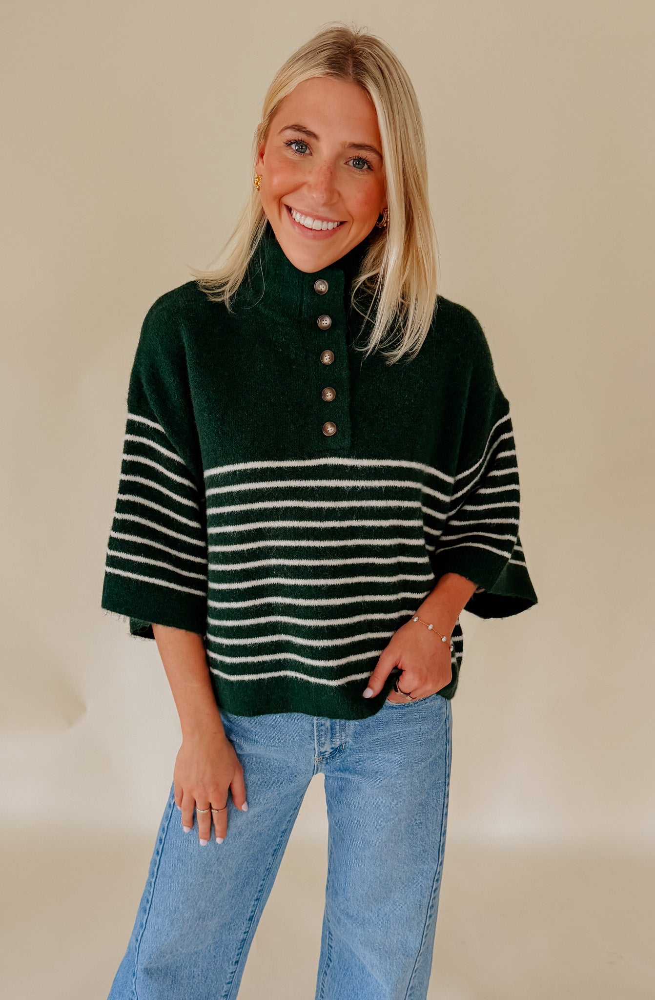 THE REAGAN STRIPED MOCK NECK SWEATER